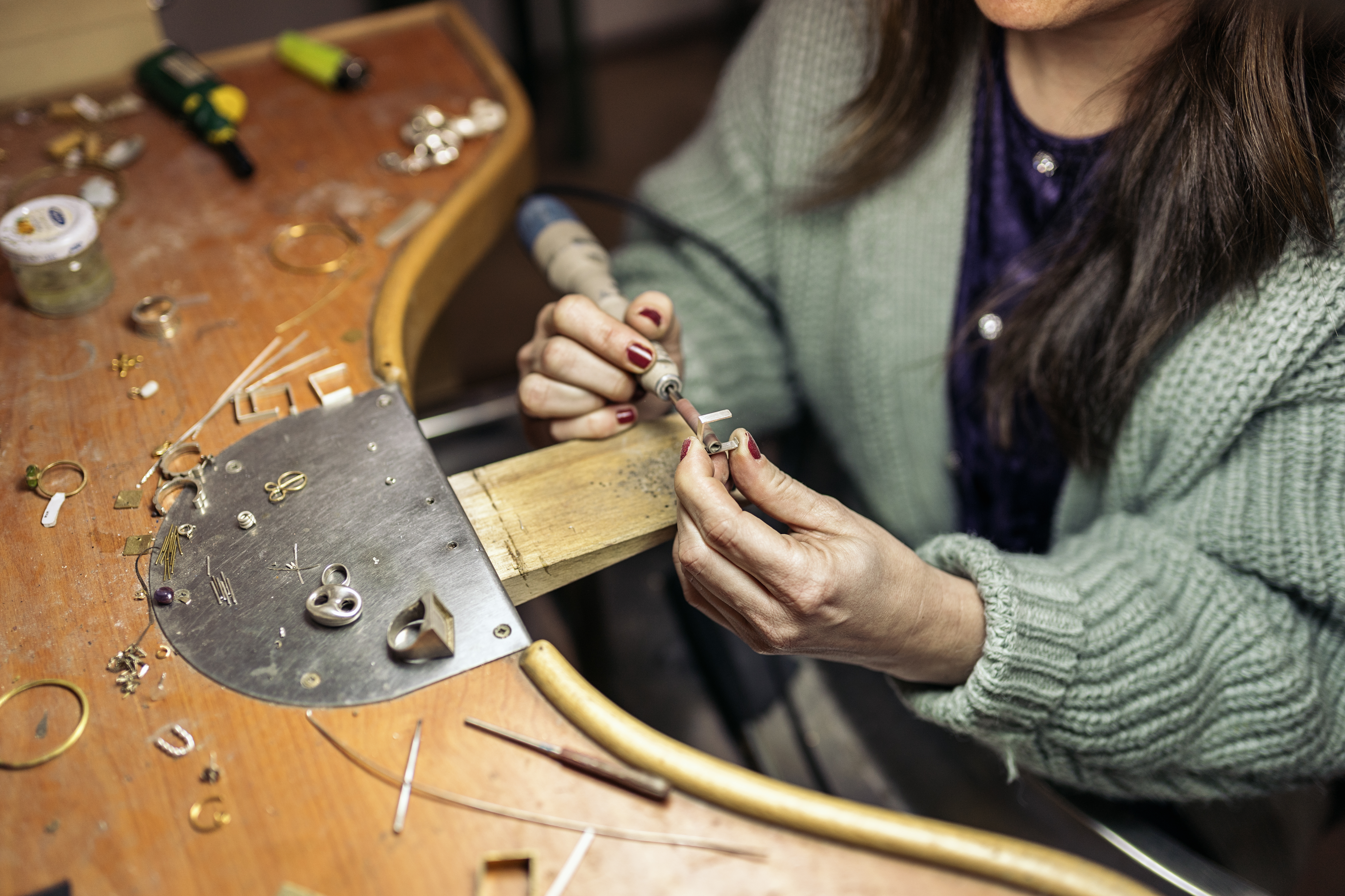 person repairing jewlery in shop